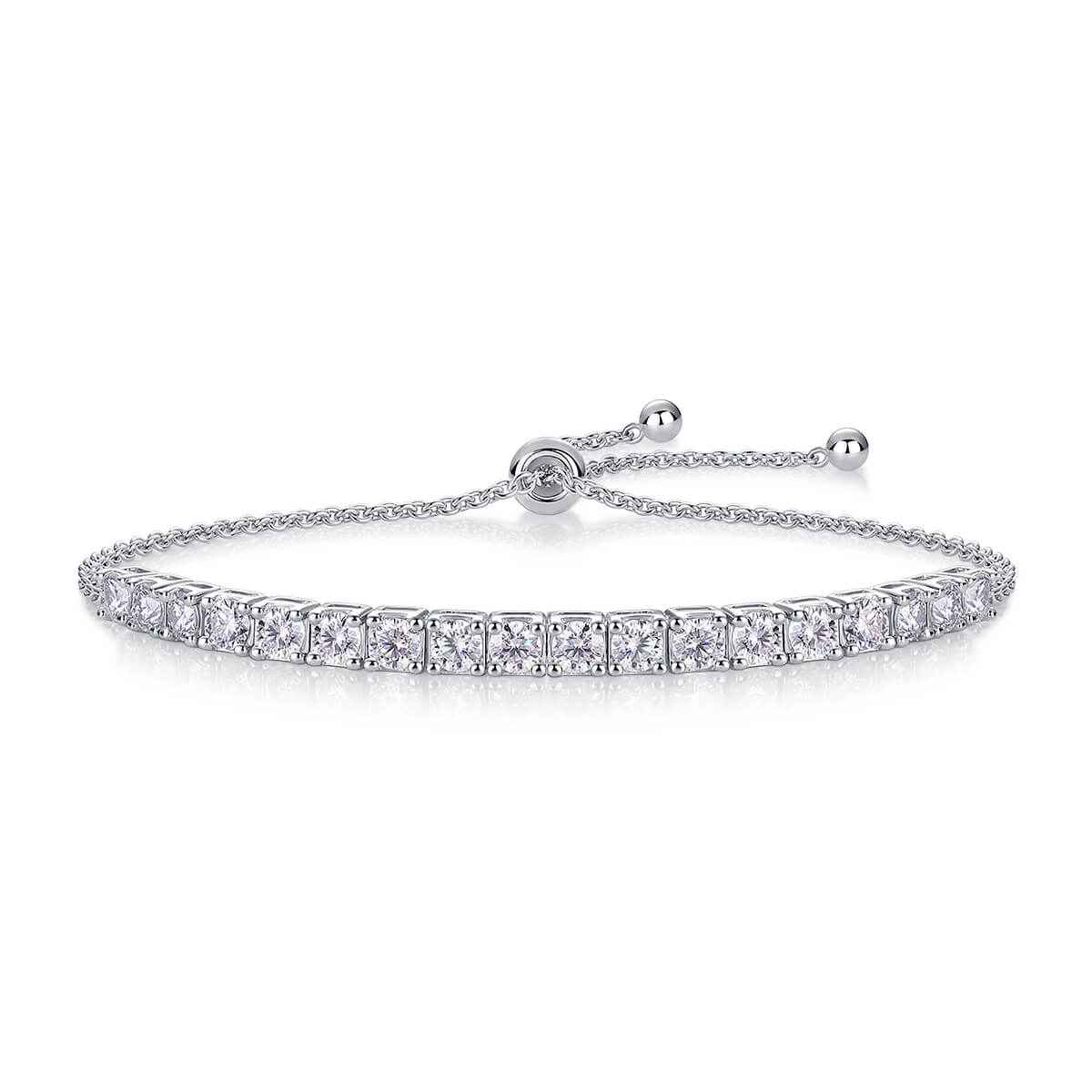 Shop Aruary's Classic Moissanite Bolo Tennis Bracelet. Solid silver adjustable link with brilliant D-color stones in 10pt, 30pt, 50pt widths. Bespoke boxed.