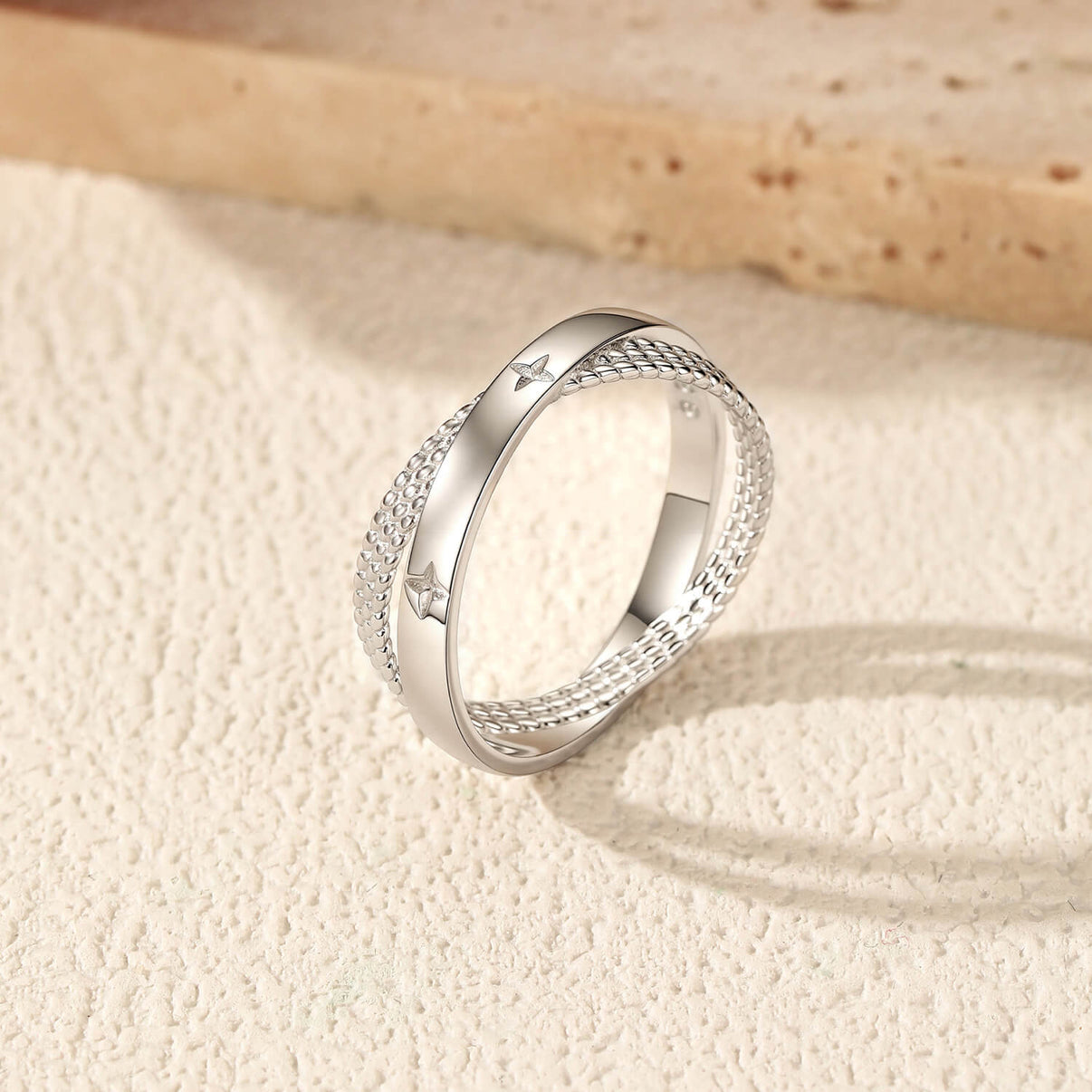 Shop Aruary's Crossed Starburst Beaded Statement Ring. Solid 2.10g S925 silver dual-layer interlocking band with celestial star engravings. Bespoke boxed.