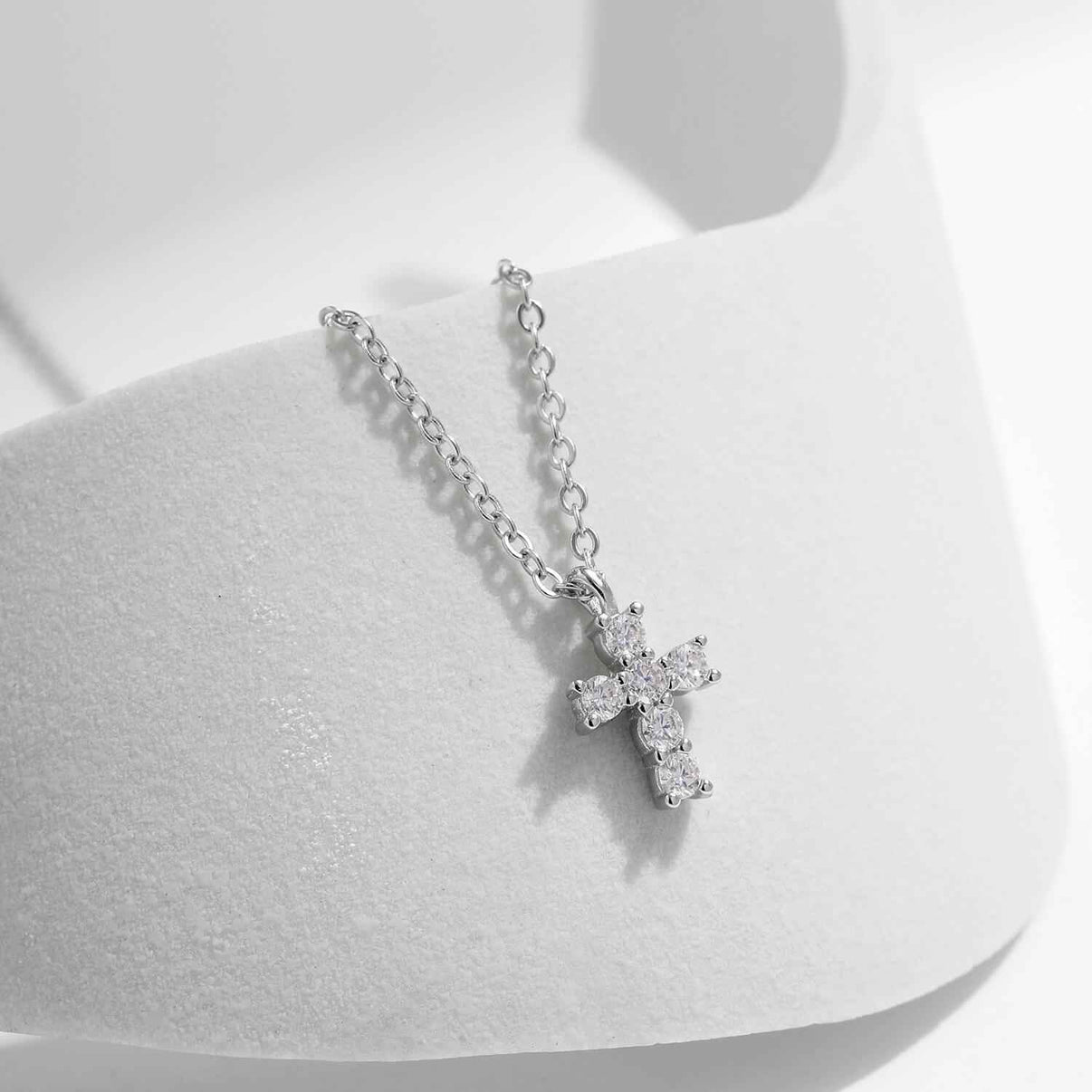 micro cross pendant necklace in platinum plated s925 silver with six claw set 0.03ct round brilliant moissanite stones