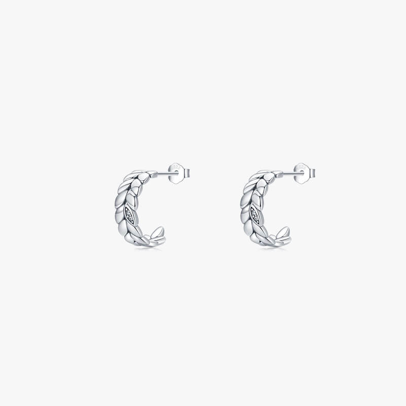 Sculptural 14mm olive leaf hoop earrings in rhodium-plated 925 sterling silver, artfully engineered for a comfortable, snag-free daily fit.