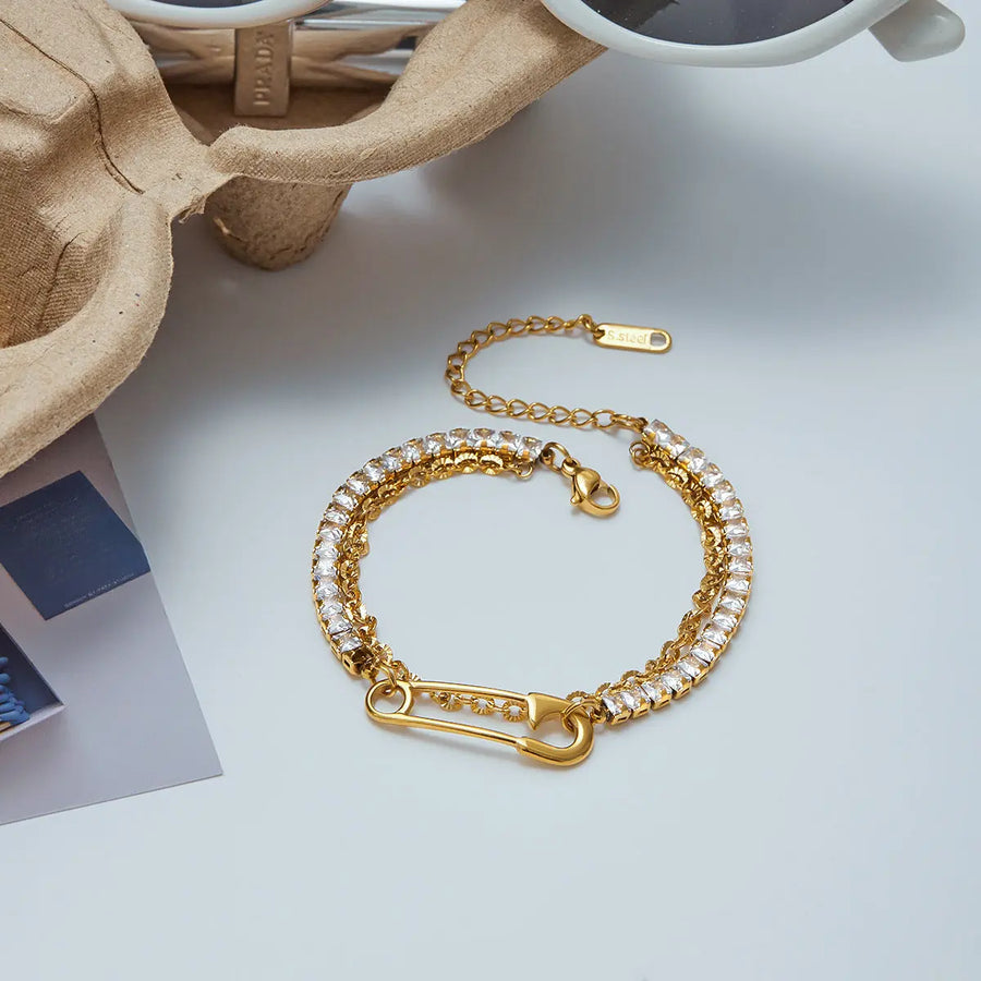 Yuqing Realm ｜ Accessories Boutique Where raw industrial edge meets gilded sophistication. This deconstructed "paperclip" chain—studded with fiery zircons—redefines modern luxury for the rule-breakers.