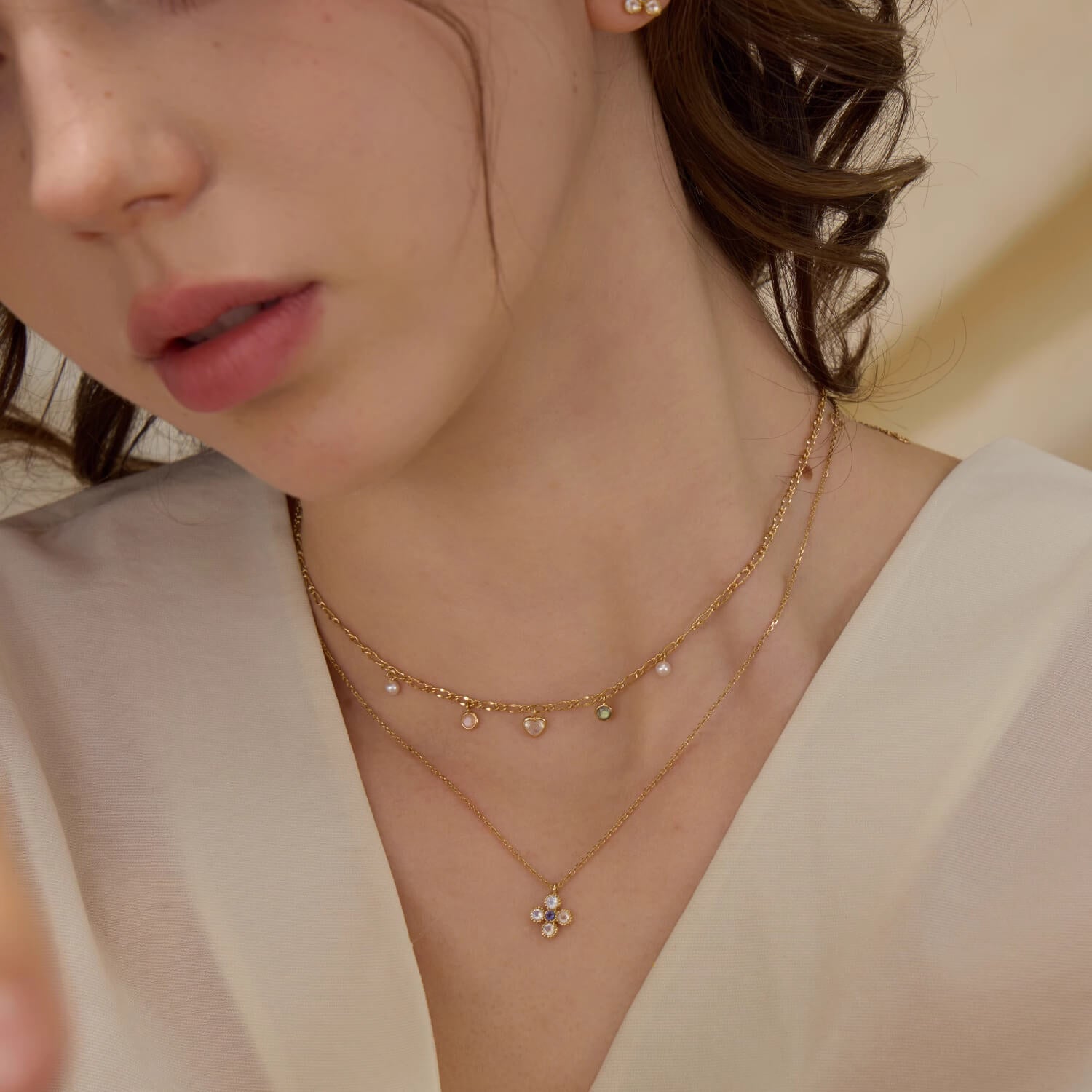 Close-up of a model wearing a gold dainty heart choker necklace, demonstrating the adjustable 37cm to 45cm length.