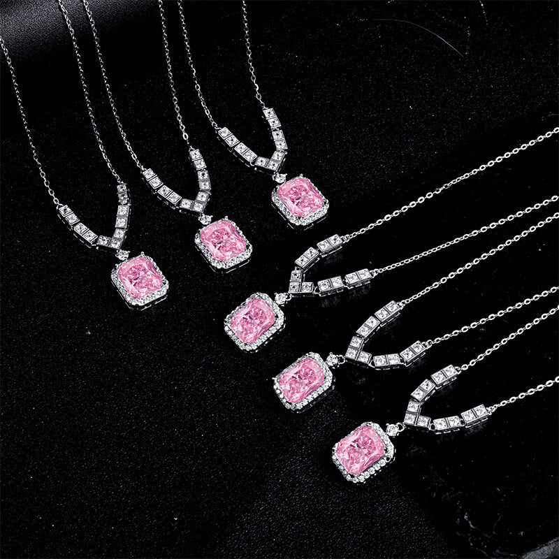 Emerald-cut pink high-carbon diamond pendant with a halo of white stones on a 925 sterling silver chain.