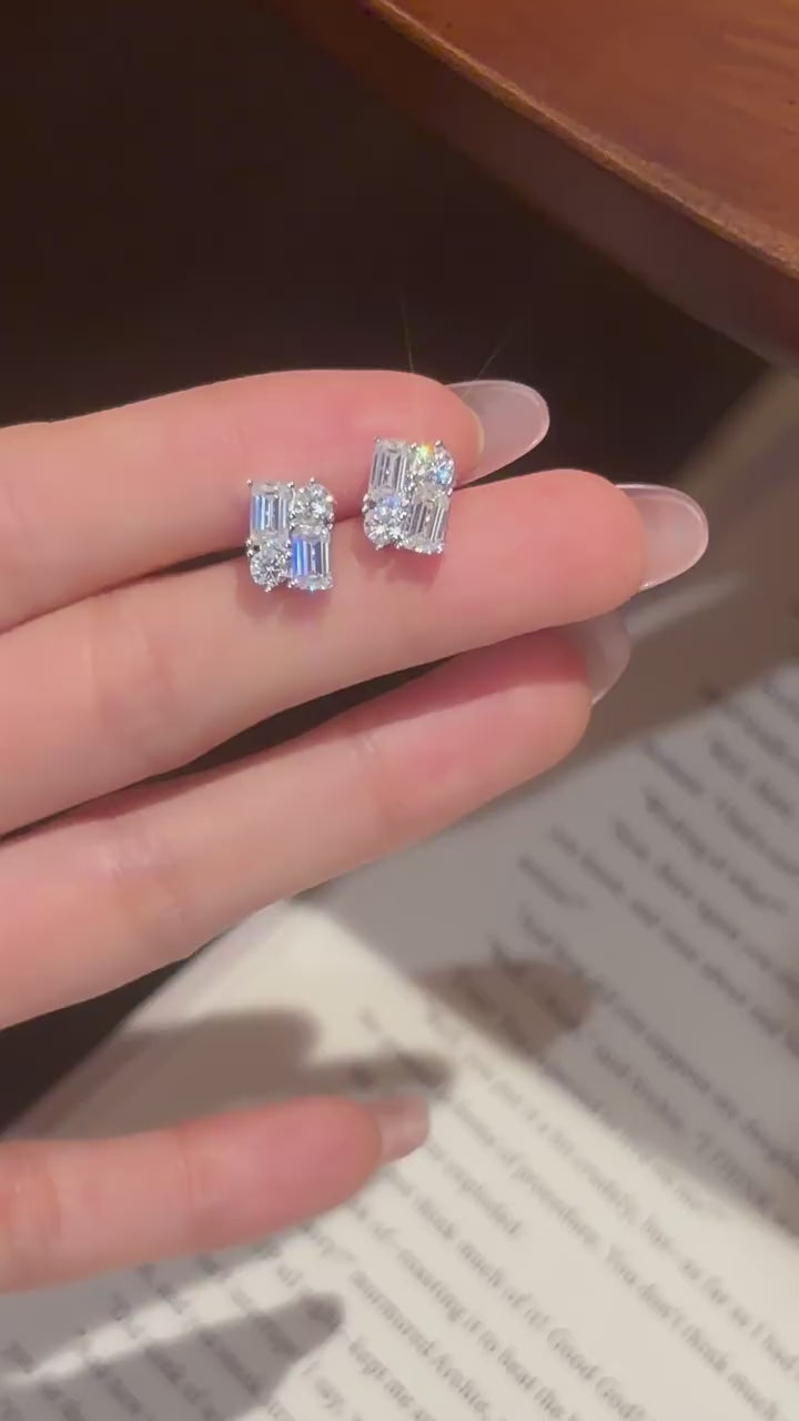 Geometric mosaic stud earrings with emerald-cut and round-cut D-color moissanites in rhodium-plated 925 silver, artfully engineered for a snag-free luxury fit.