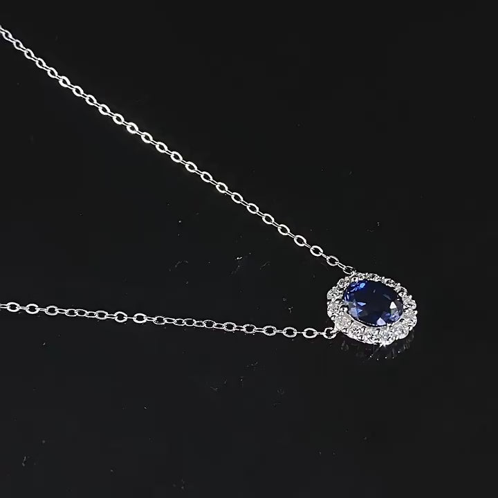 A luxurious 925 sterling silver heart of the sea necklace with a deep blue sapphire-colored stone, 18K Champagne gold plated for a royal finish.