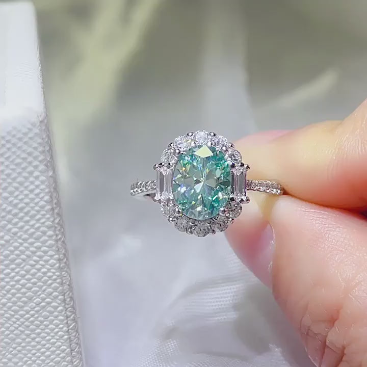 heavy round brilliant cut mint green moissanite statement ring in platinum plated s925 silver with heavy clear cz sunburst halo