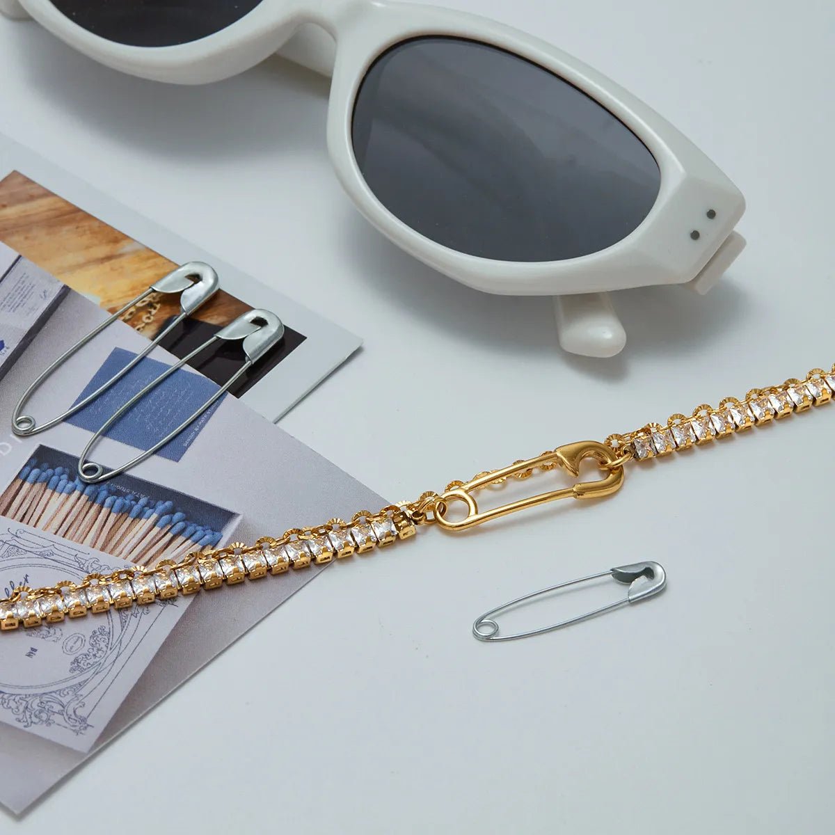 Where raw industrial edge meets gilded sophistication. This deconstructed "paperclip" chain—studded with fiery zircons—redefines modern luxury for the rule - breakers. - Aruary Studio ｜ Artisanal Jewelry